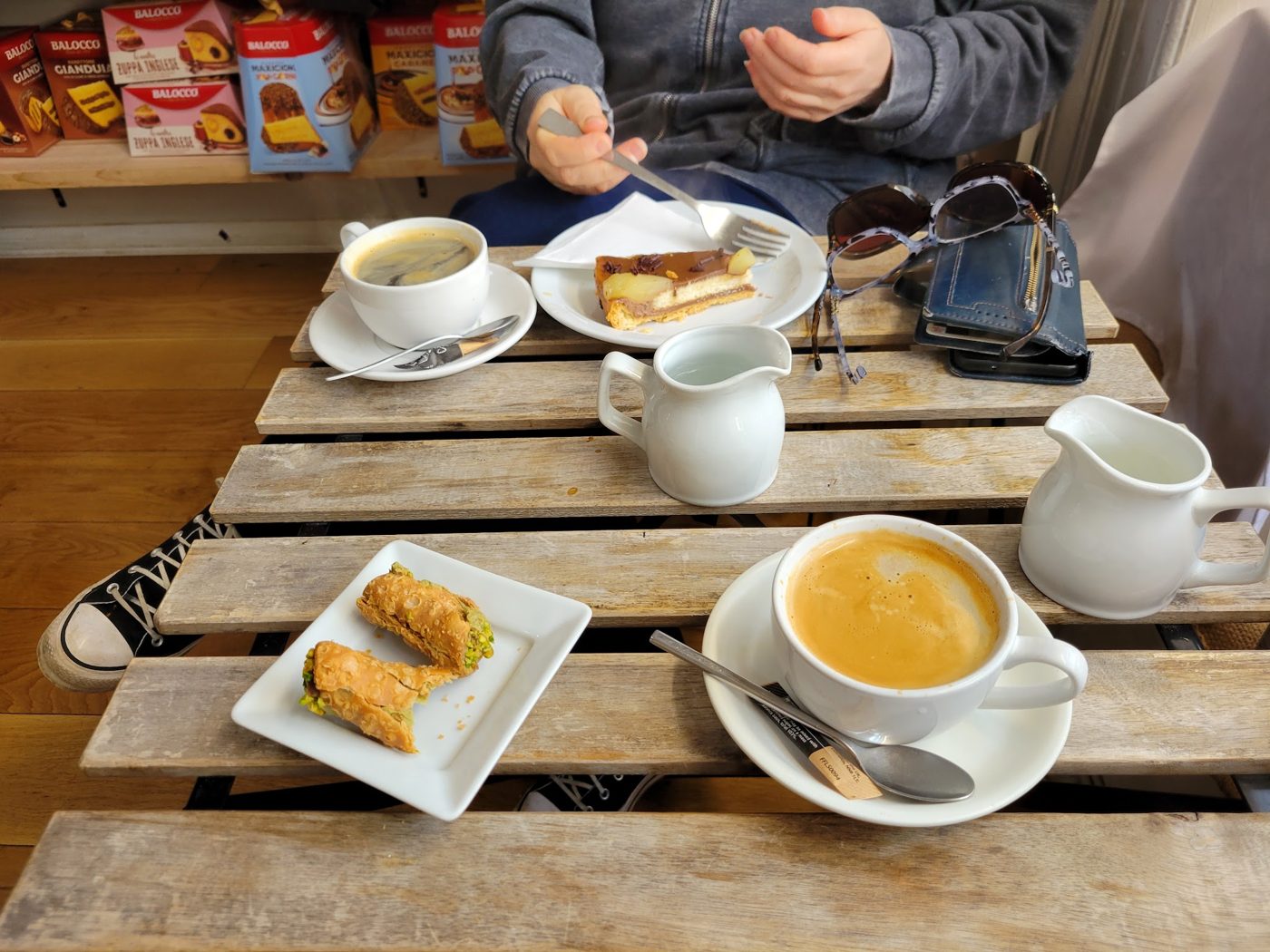 Coffees and pastries on a wooden table