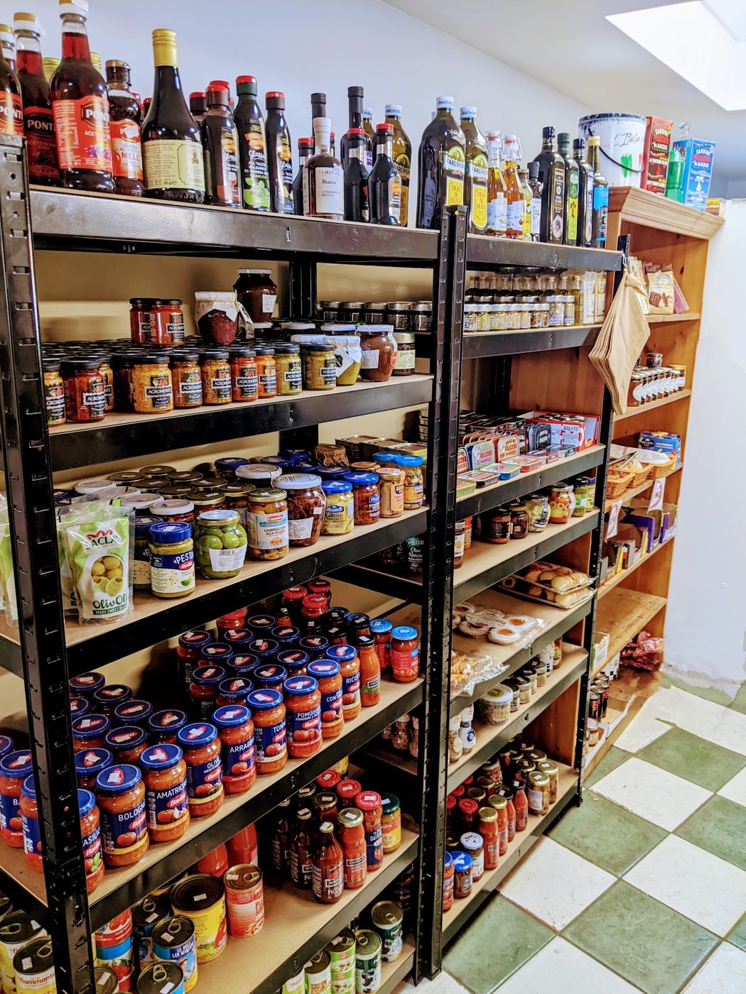 Shelves of jars, sauces and bottles