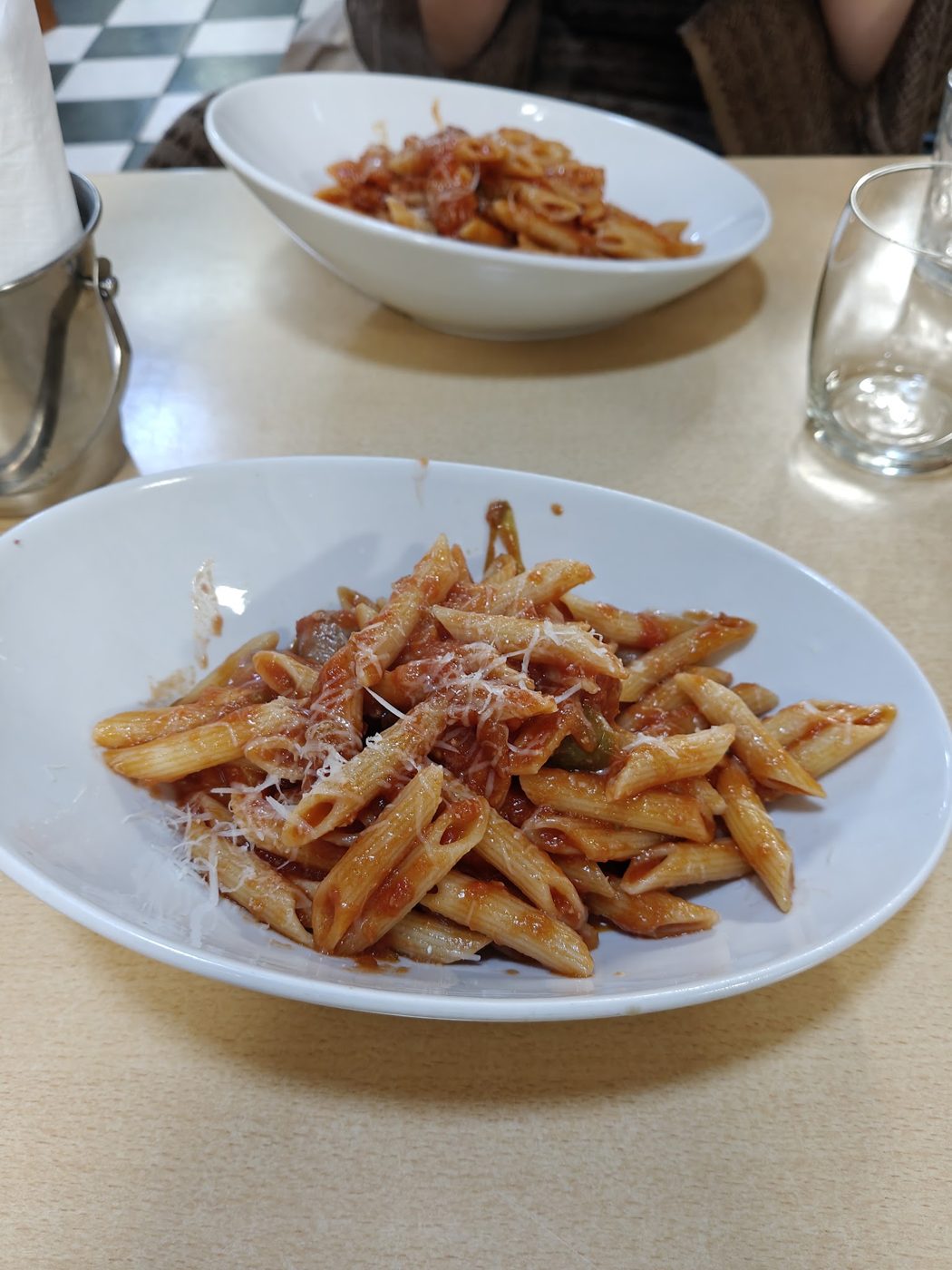 Penne in tomato sauce with grated cheese