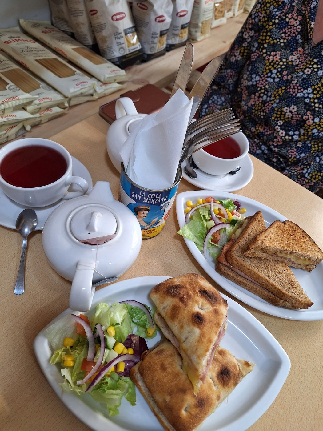Toasted sandwiches with salad and a pot of tea